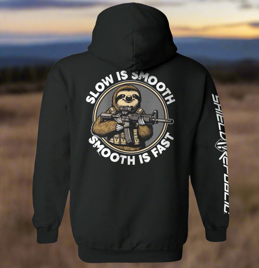 Black hoodie with a graphic of a sloth holding a rifle and text 'Slow is Smooth, Smooth is Fast' on the back.