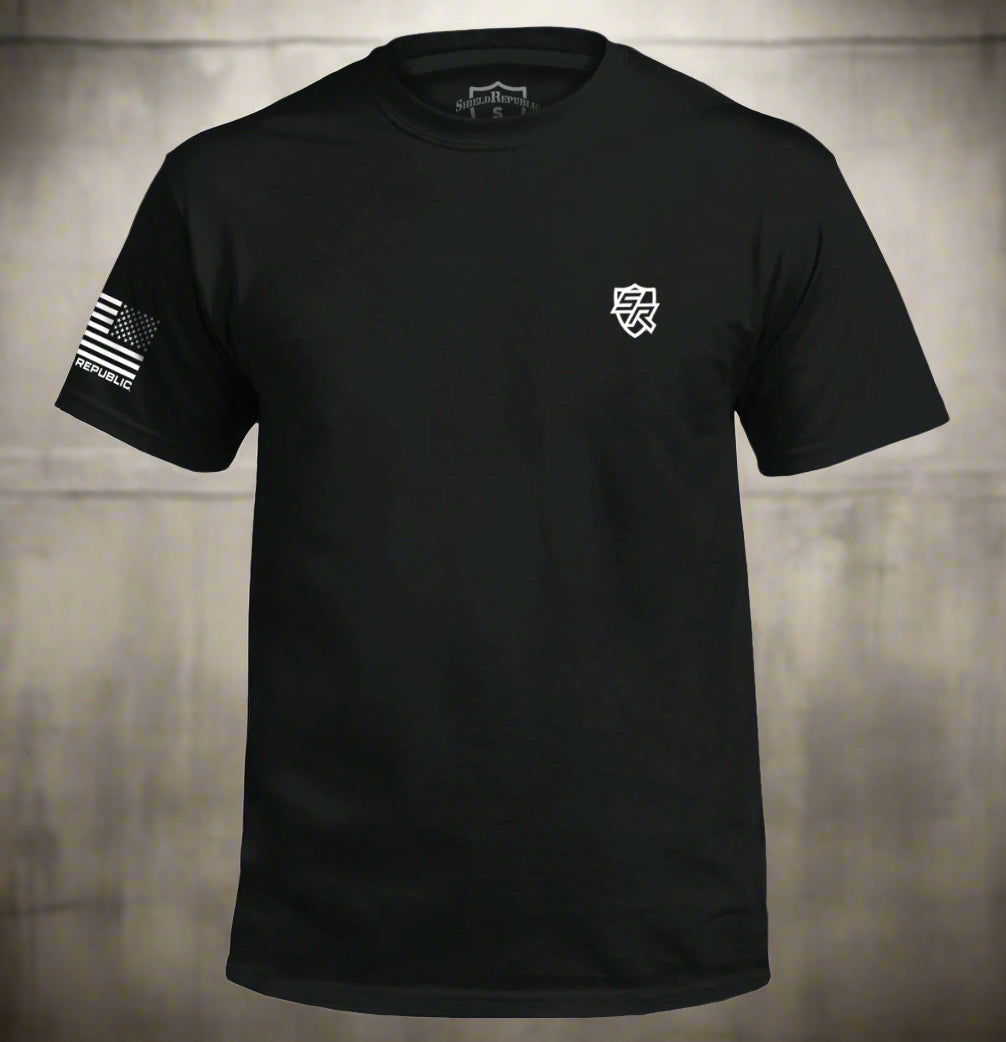 Black t-shirt with a logo on the chest and a patch on the sleeve against a white background