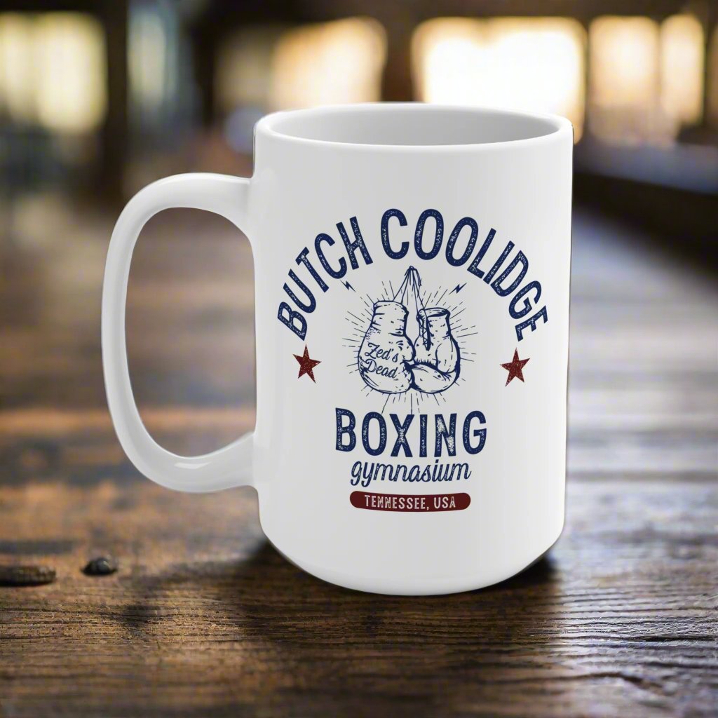 a coffee mug on a rustic coffee table in a grungy boxing gym at magic hour