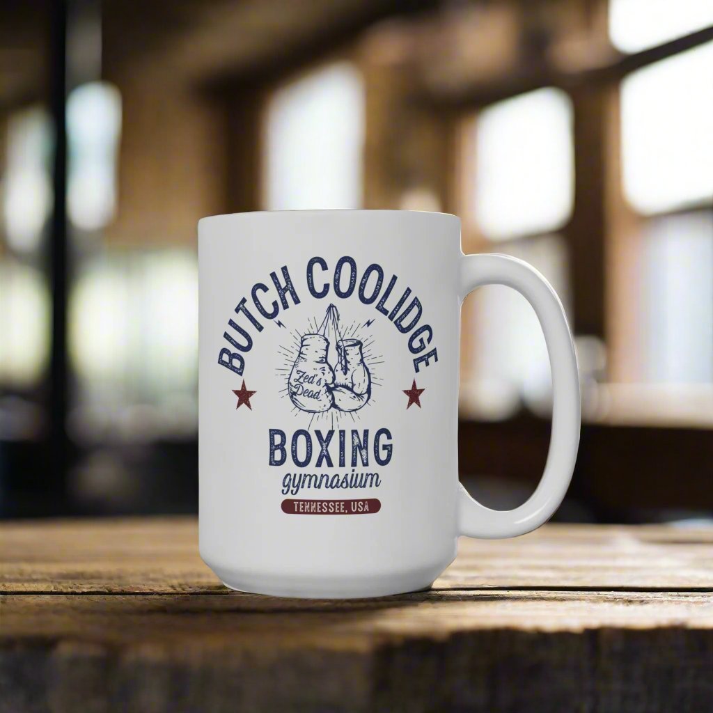 a coffee mug on a coffee table in a boxing gym at magic hour