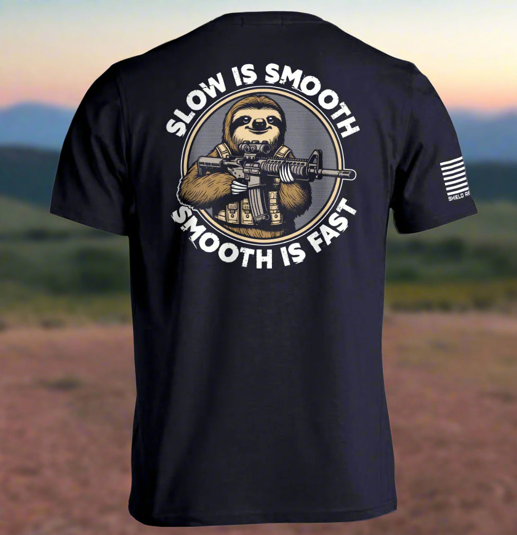 Navy t-shirt with a sloth holding a rifle graphic and text on the back, on a white background.